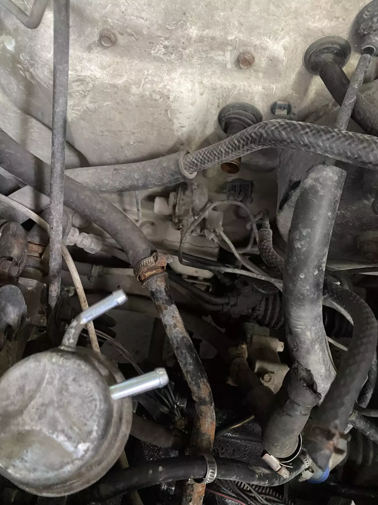 Нижній патрубок пічки(вигляд закритий шлангом)